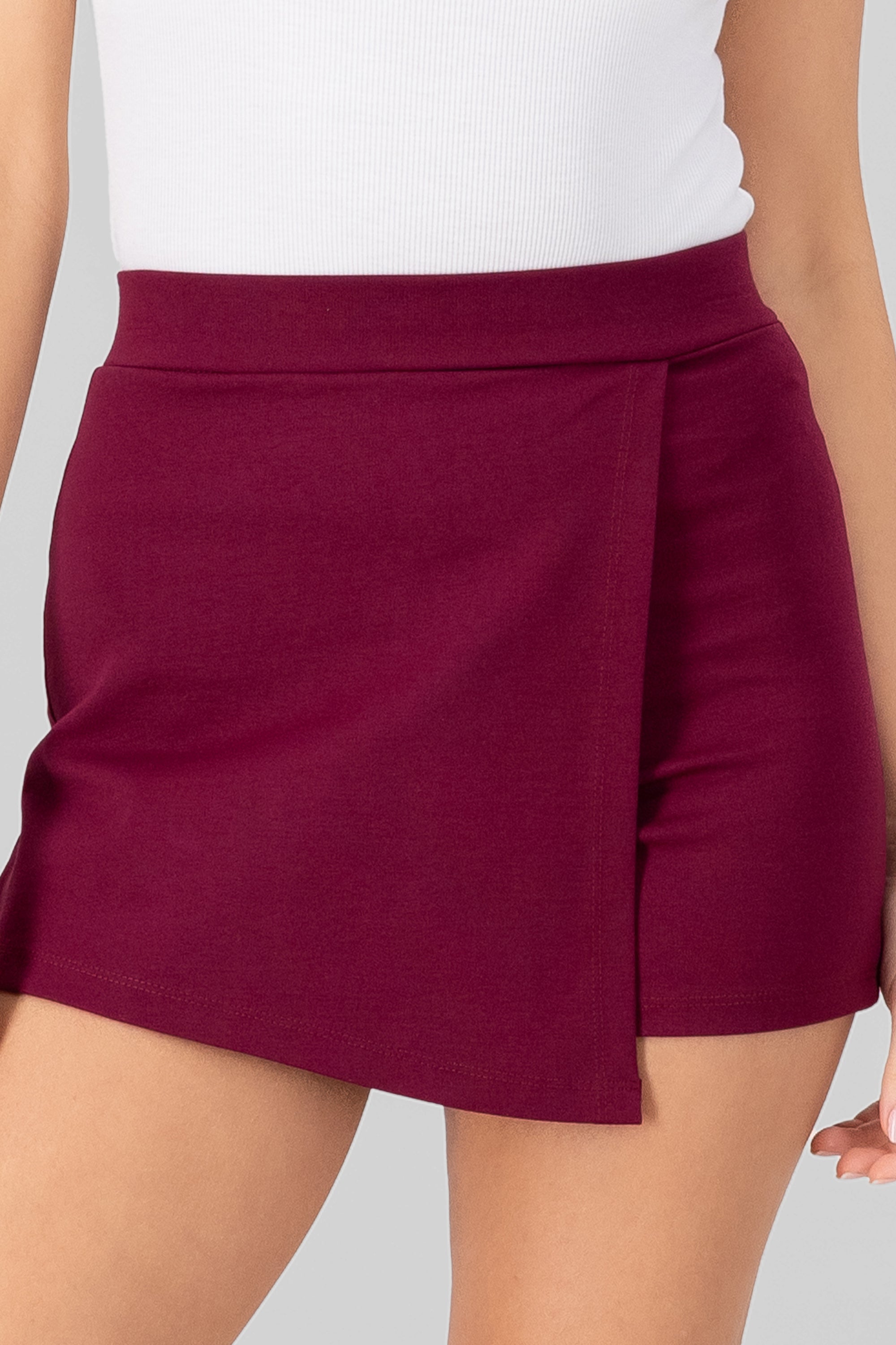 Asymmetric solid skort BURGUNDY